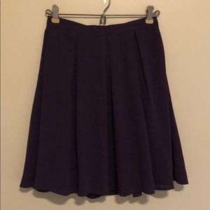 Purple pleated mini skirt